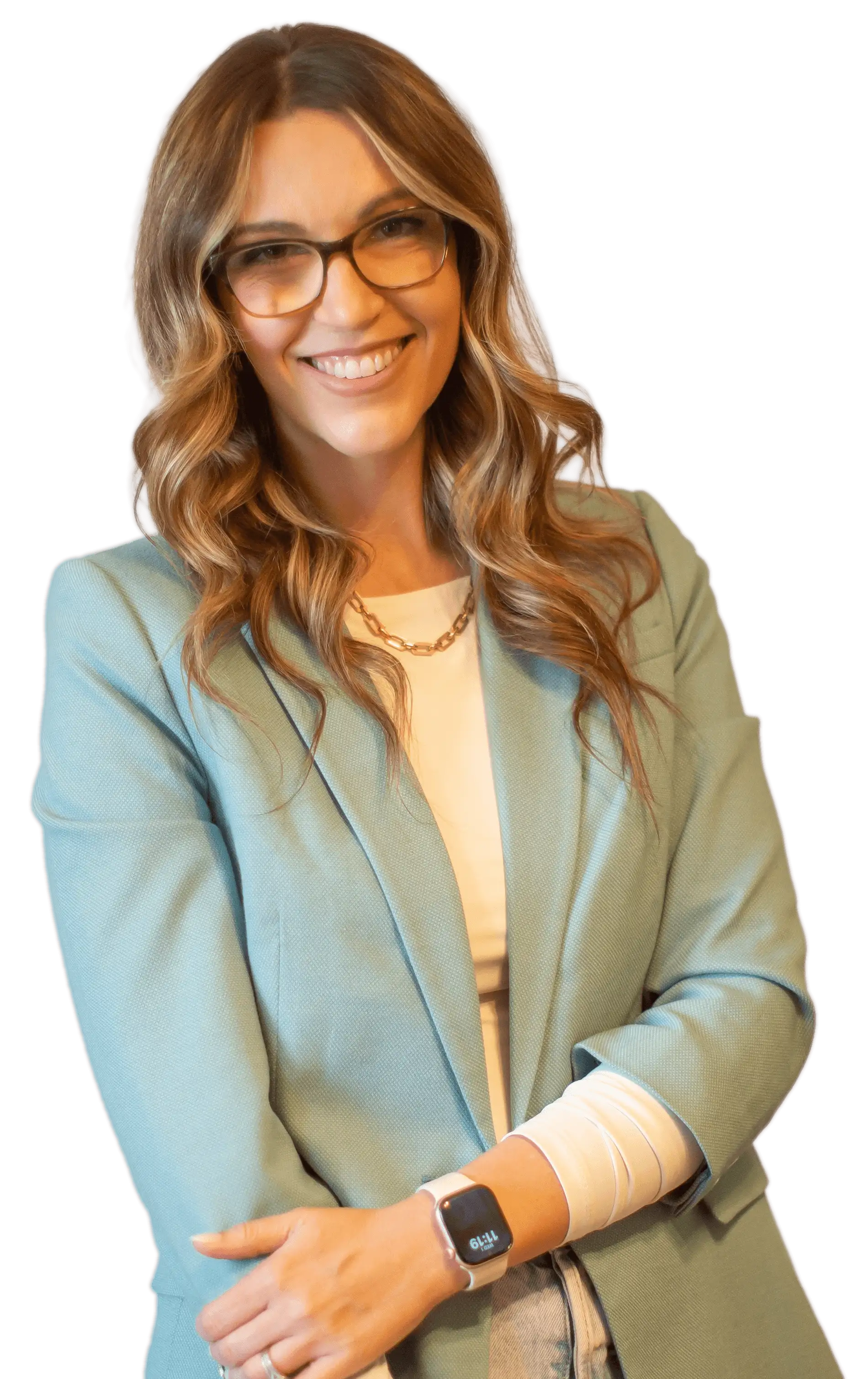 Jade Bruno, Licensed Marriage & Family Therapist, standing in a sage jacket, smiling